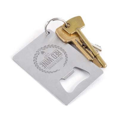 Brushed metal credit card bottle opener with engraved design attached to a keyring with gold keys