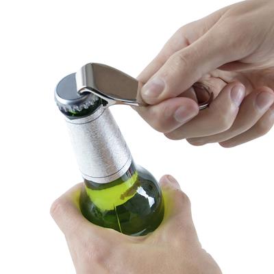 Person opening a bottle with the Oracle bottle opener keyring

