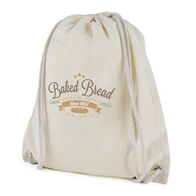 Angled view of natural cotton drawstring bag showing printed logo on front and drawstring closure