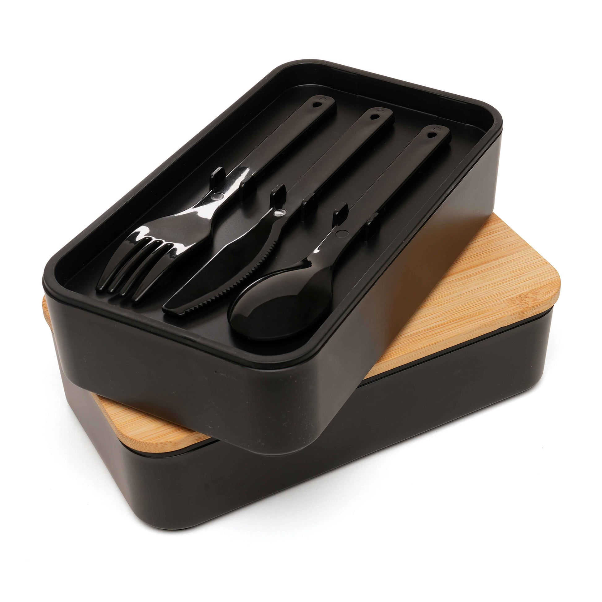 Double stacked lunch box showing cutlery set arranged in top compartment with bamboo lid underneath